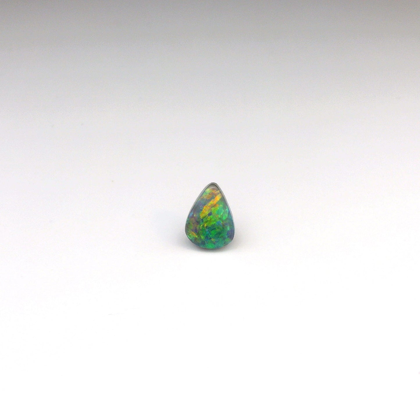 0.77ct Green, Orange Opal Gemstone