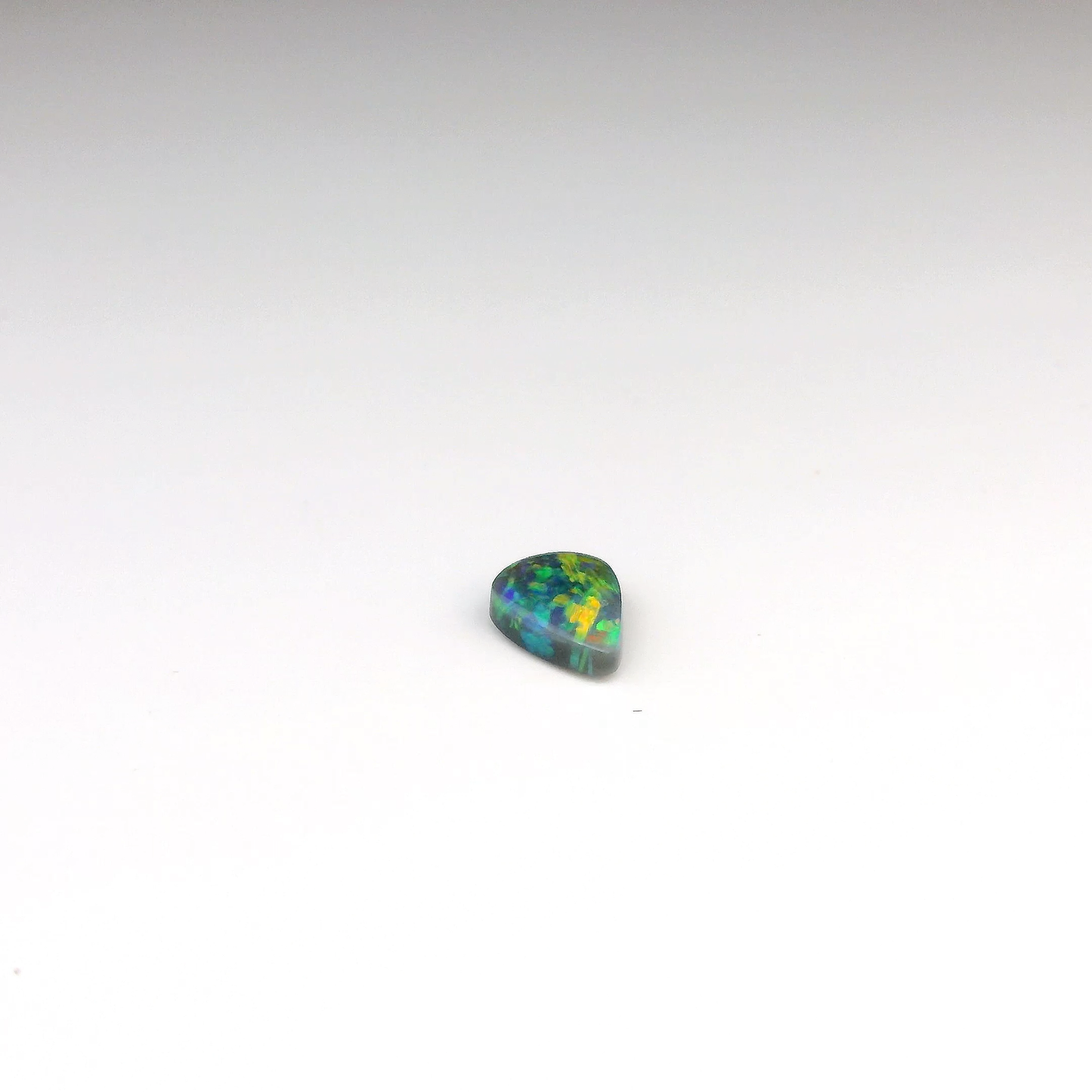0.77ct Green, Orange Opal Gemstone