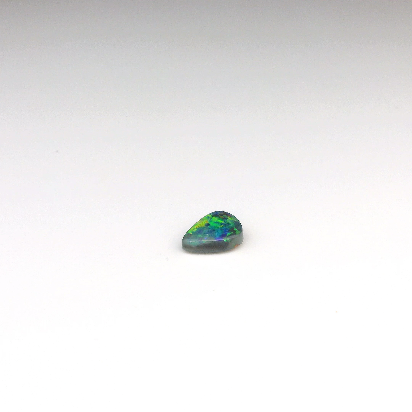 0.77ct Green, Orange Opal Gemstone
