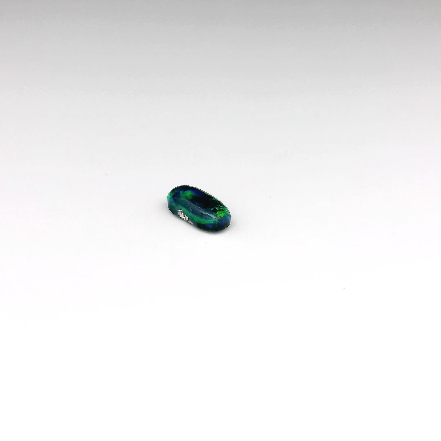 0.73ct Green, Orange Opal Gemstone