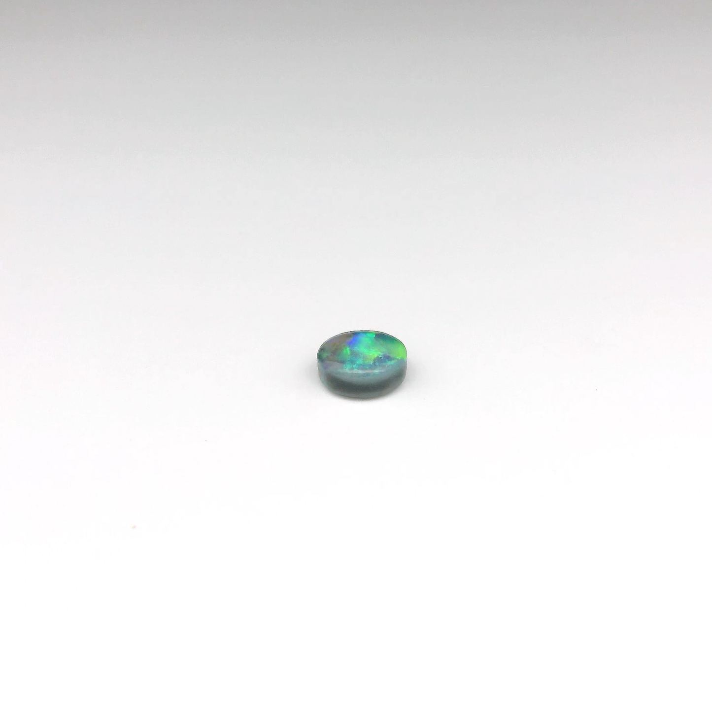 0.61ct Green, Orange Opal Gemstone