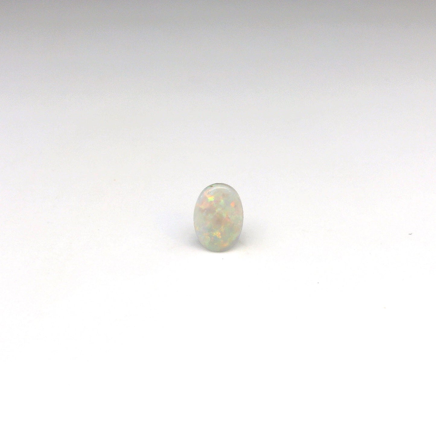 0.69ct Green, Orange Opal Gemstone