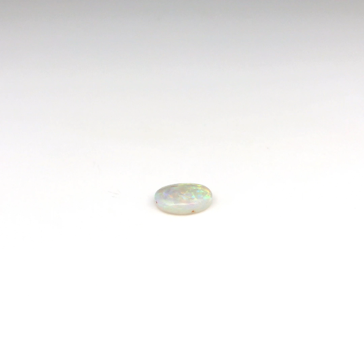 0.69ct Green, Orange Opal Gemstone