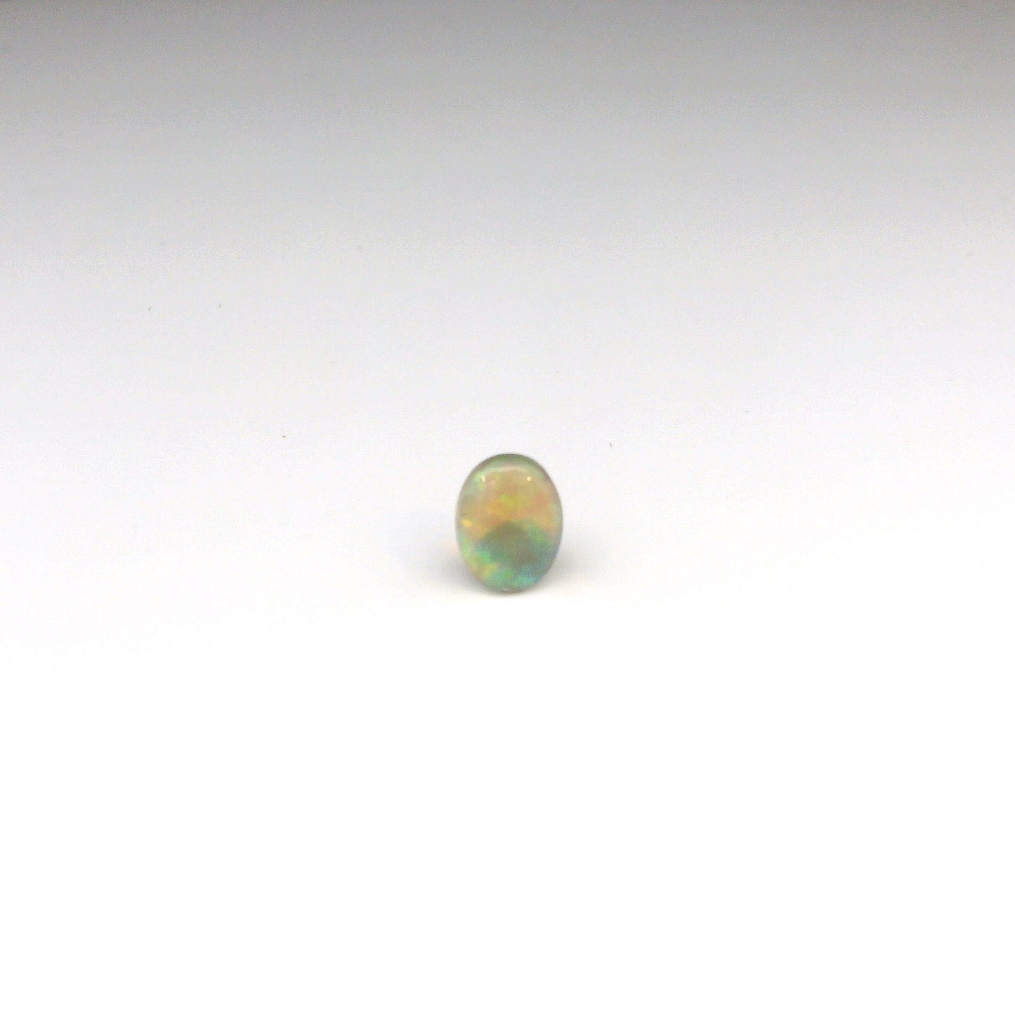 0.81ct Orange, Green Gemstone
