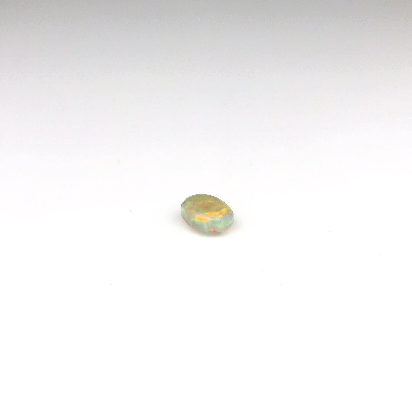 0.81ct Orange, Green Gemstone