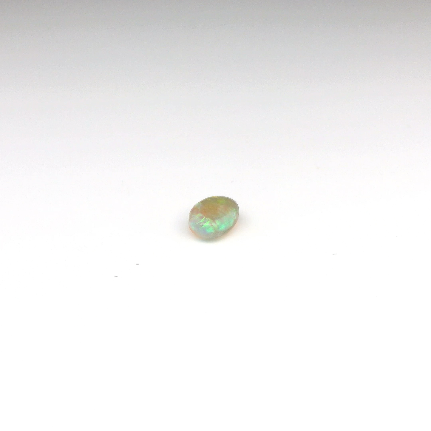 0.81ct Orange, Green Gemstone