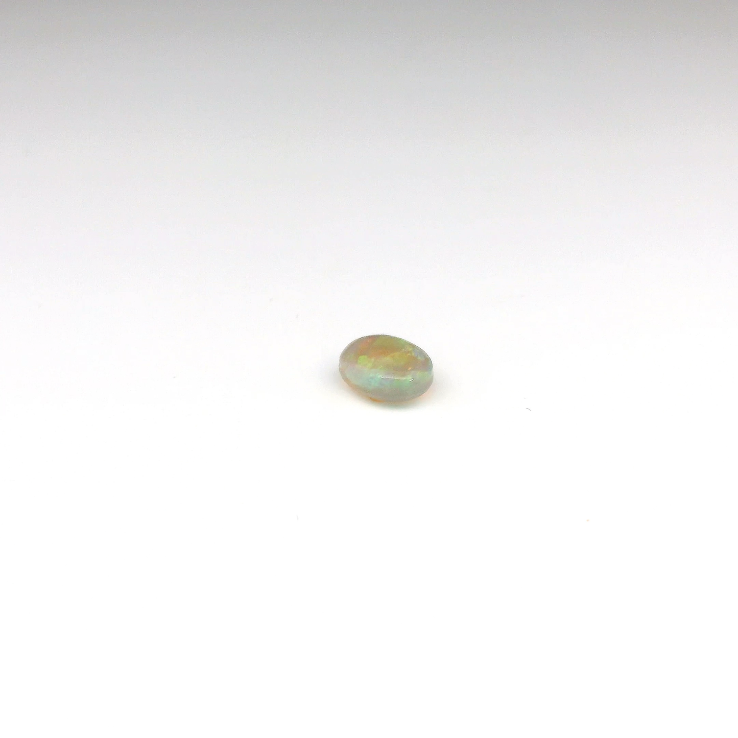 0.81ct Orange, Green Gemstone
