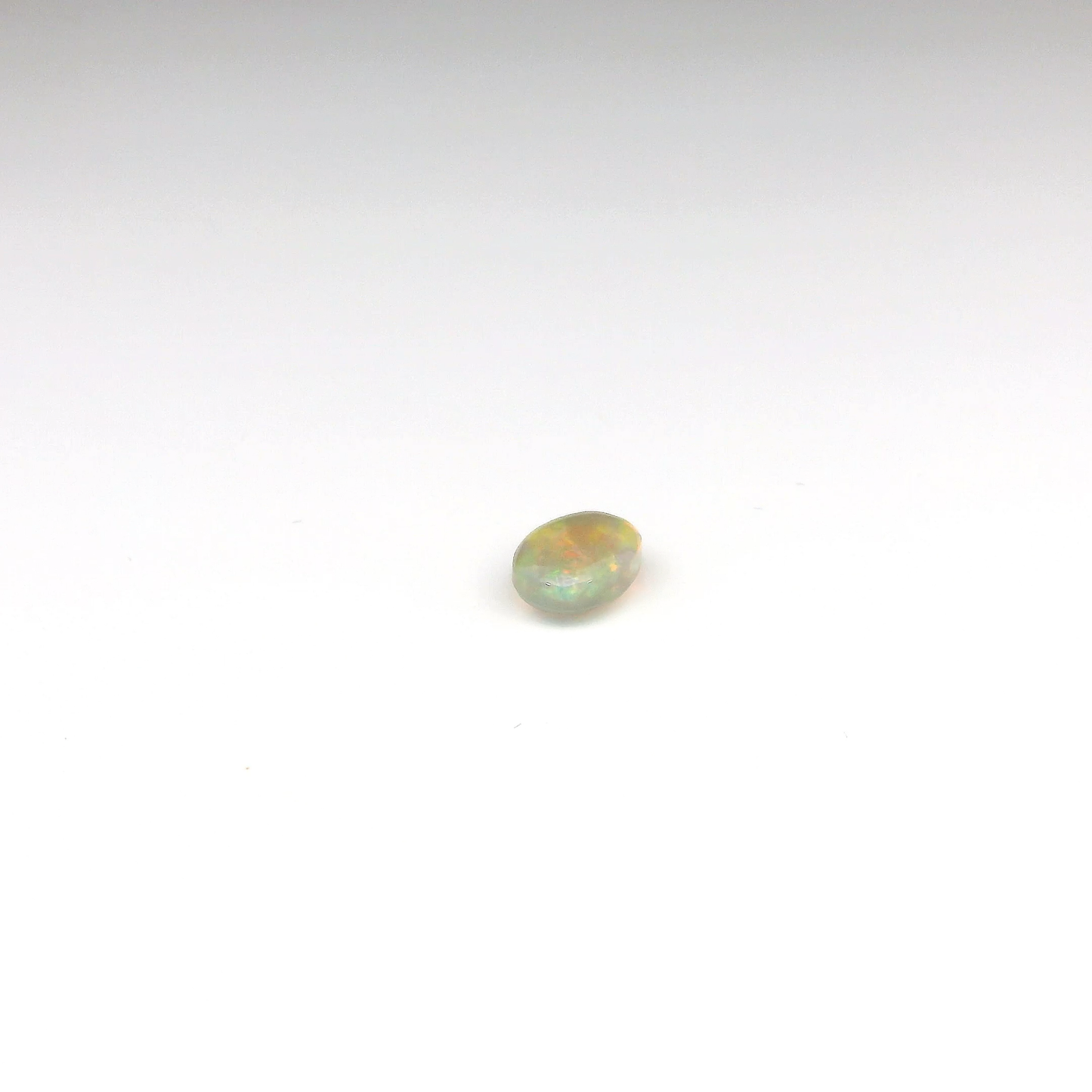 0.81ct Orange, Green Gemstone