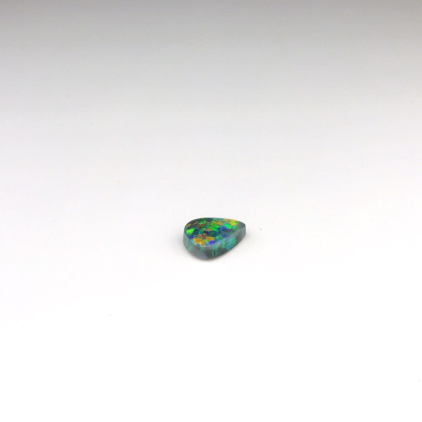 0.77ct Green, Orange Opal Gemstone