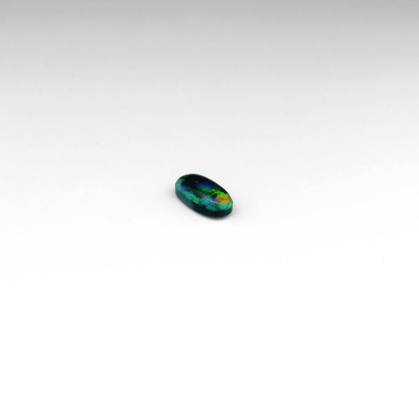 0.73ct Green, Orange Opal Gemstone