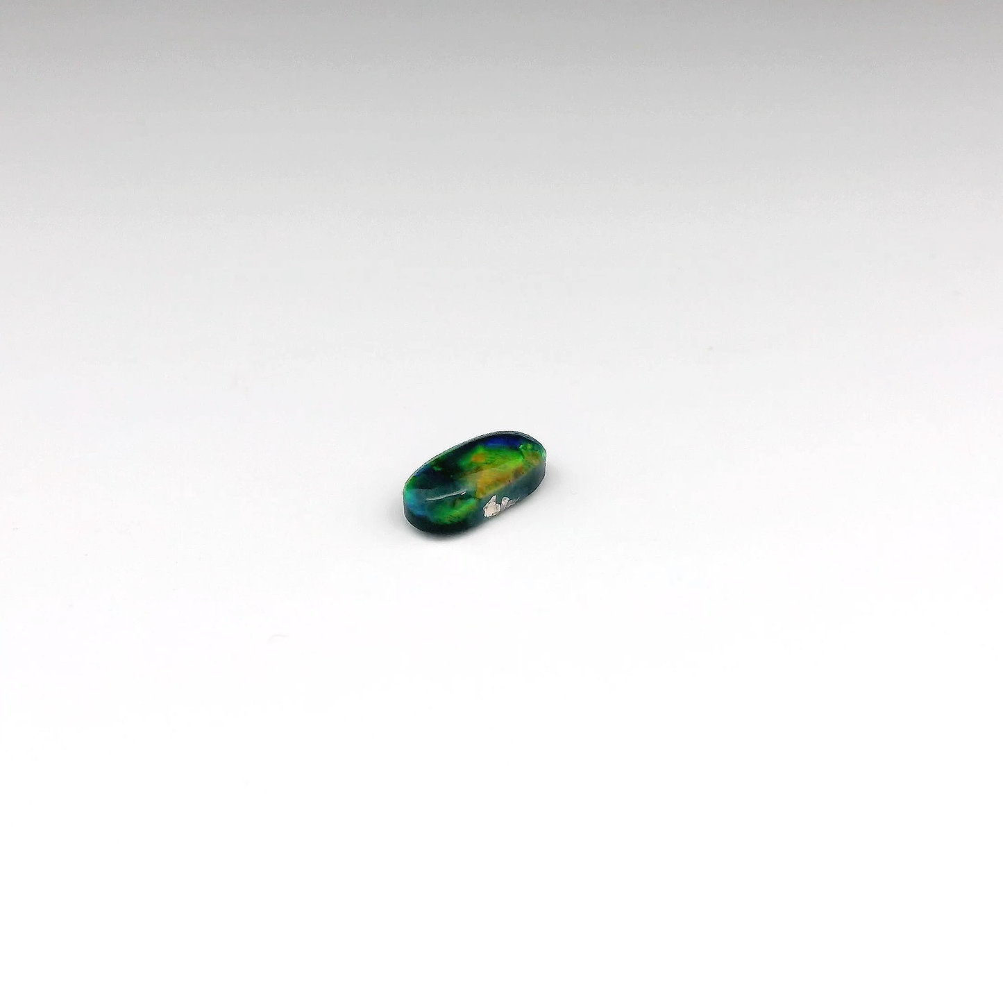 0.73ct Green, Orange Opal Gemstone