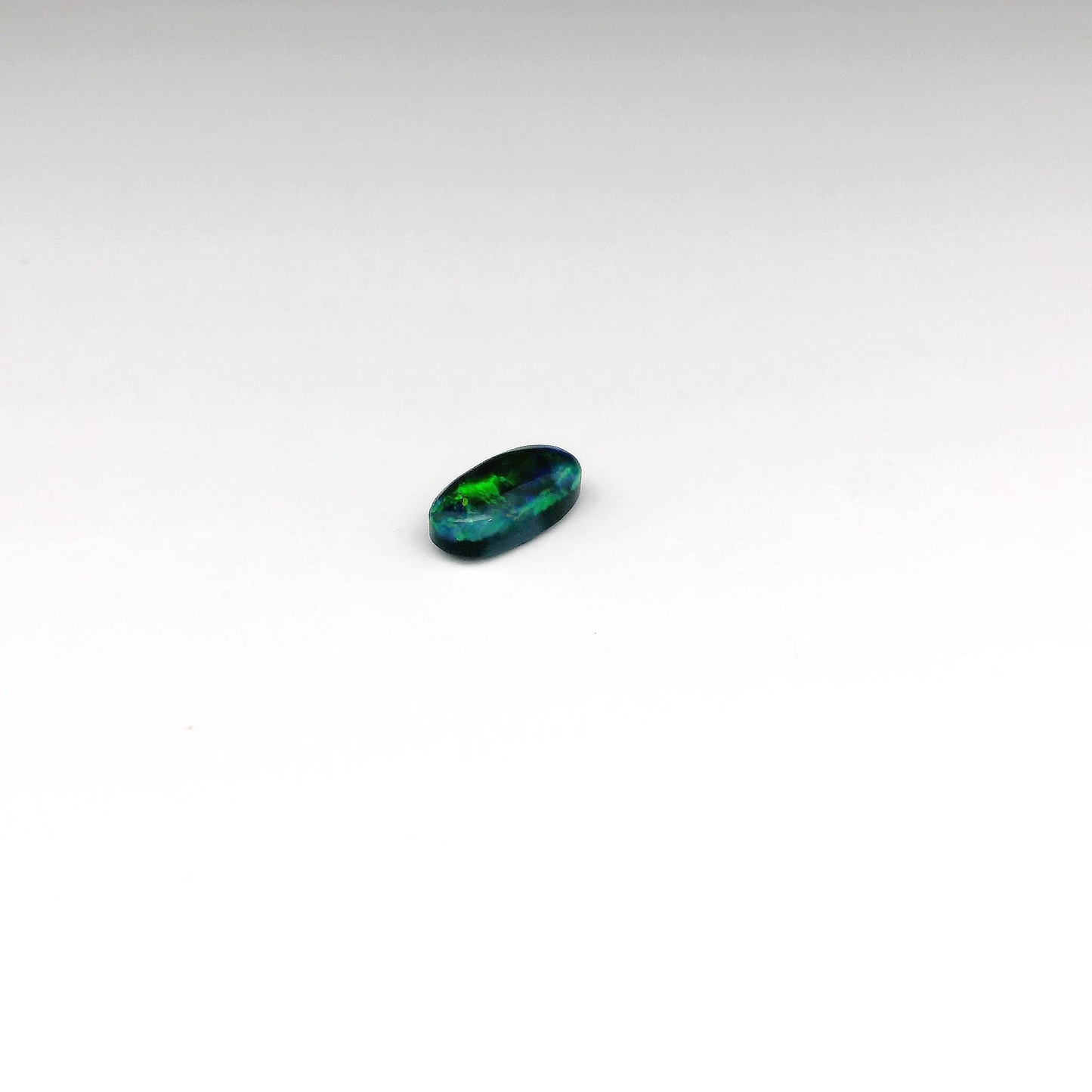 0.73ct Green, Orange Opal Gemstone