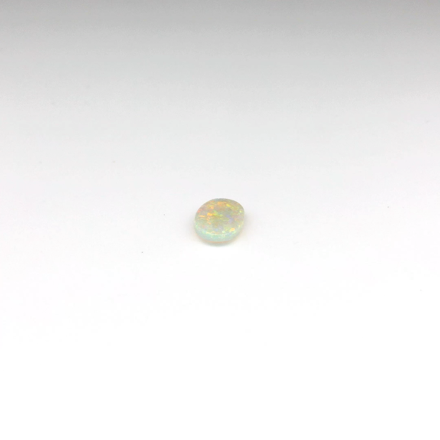 0.55ct Orange Multicolour Opal Gemstone