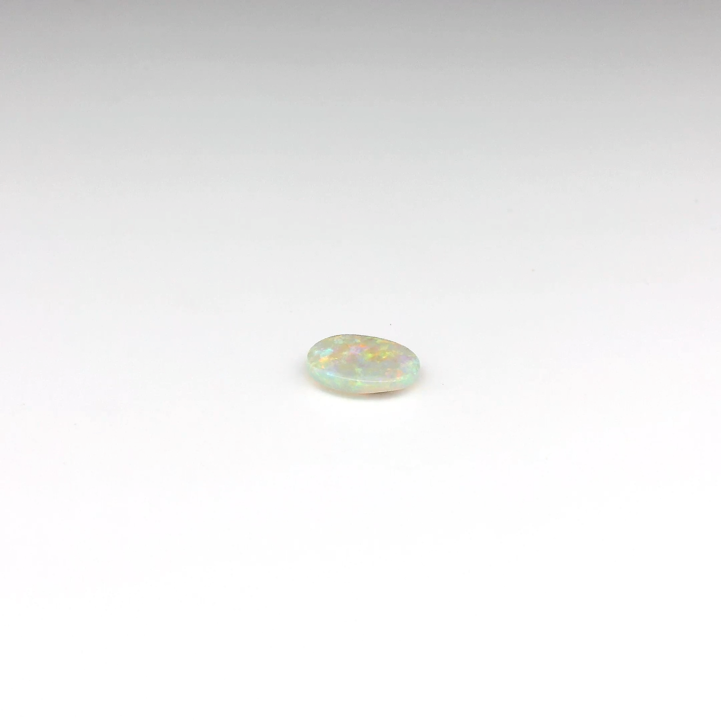 0.55ct Orange Multicolour Opal Gemstone