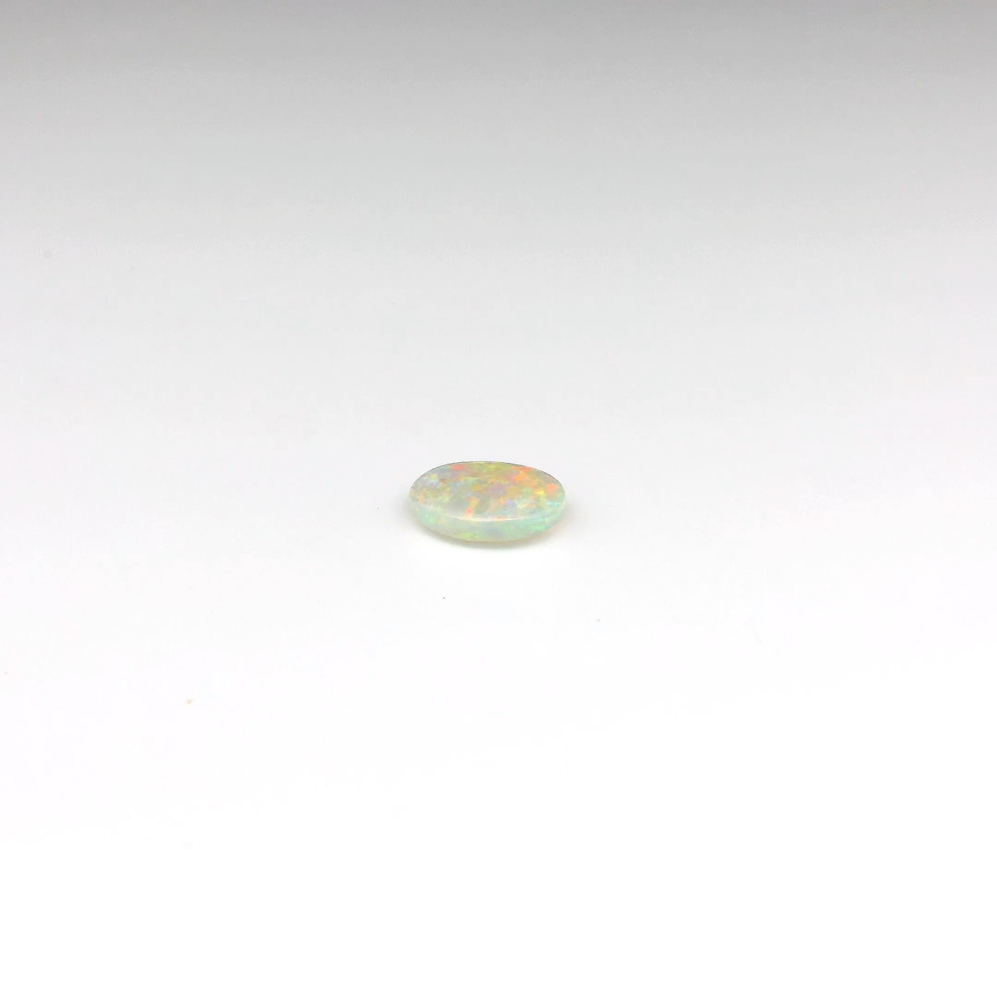0.55ct Orange Multicolour Opal Gemstone