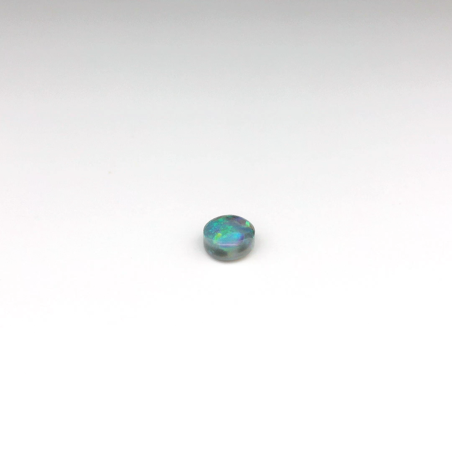 0.61ct Green, Orange Opal Gemstone