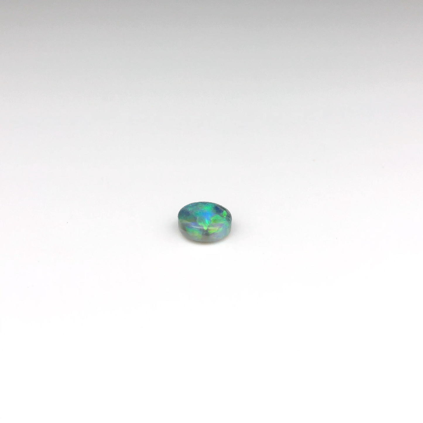 0.61ct Green, Orange Opal Gemstone