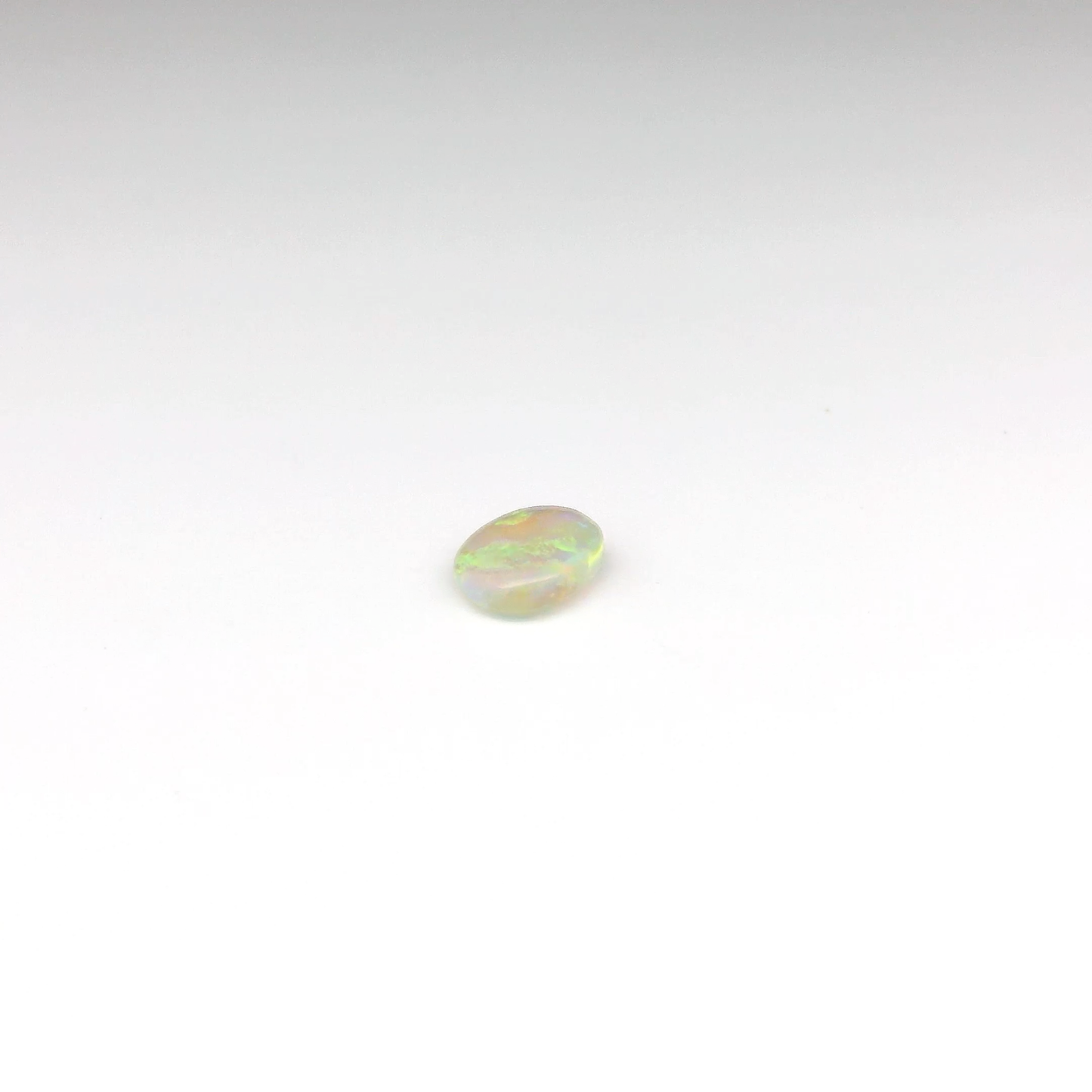 0.63ct Orange, Green Opal Gemstone