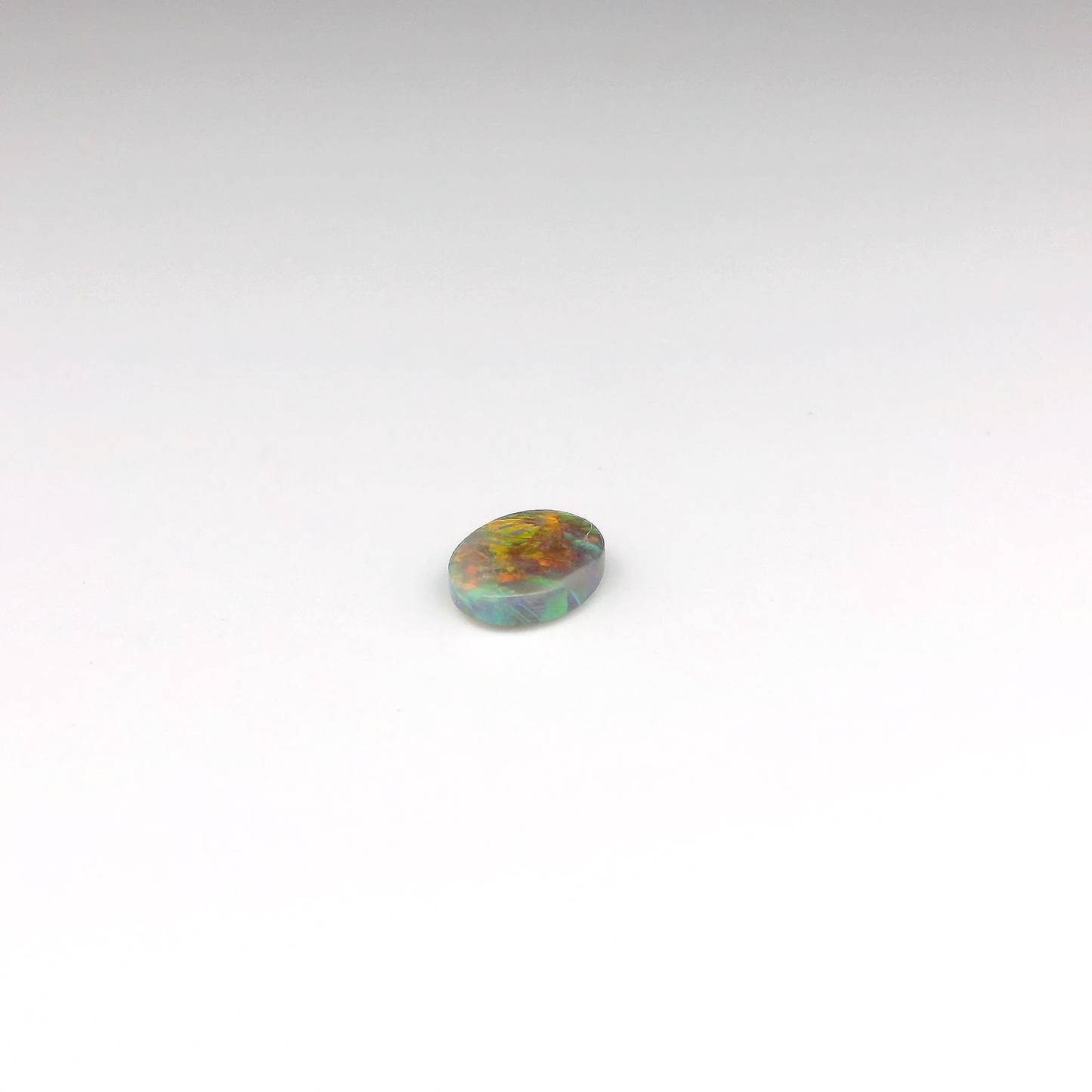 0.7ct Orange, Red Opal Gemstone