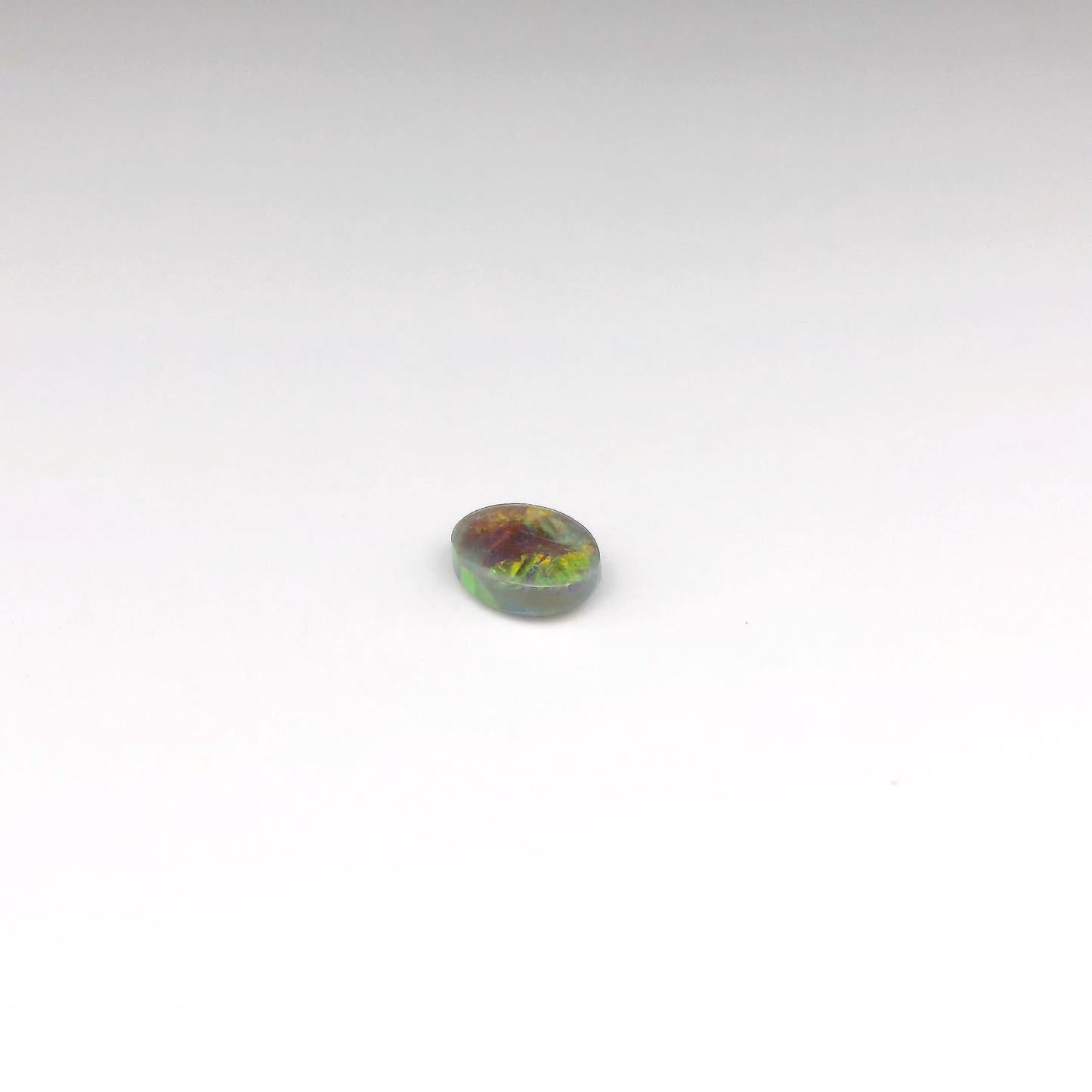 0.7ct Orange, Red Opal Gemstone