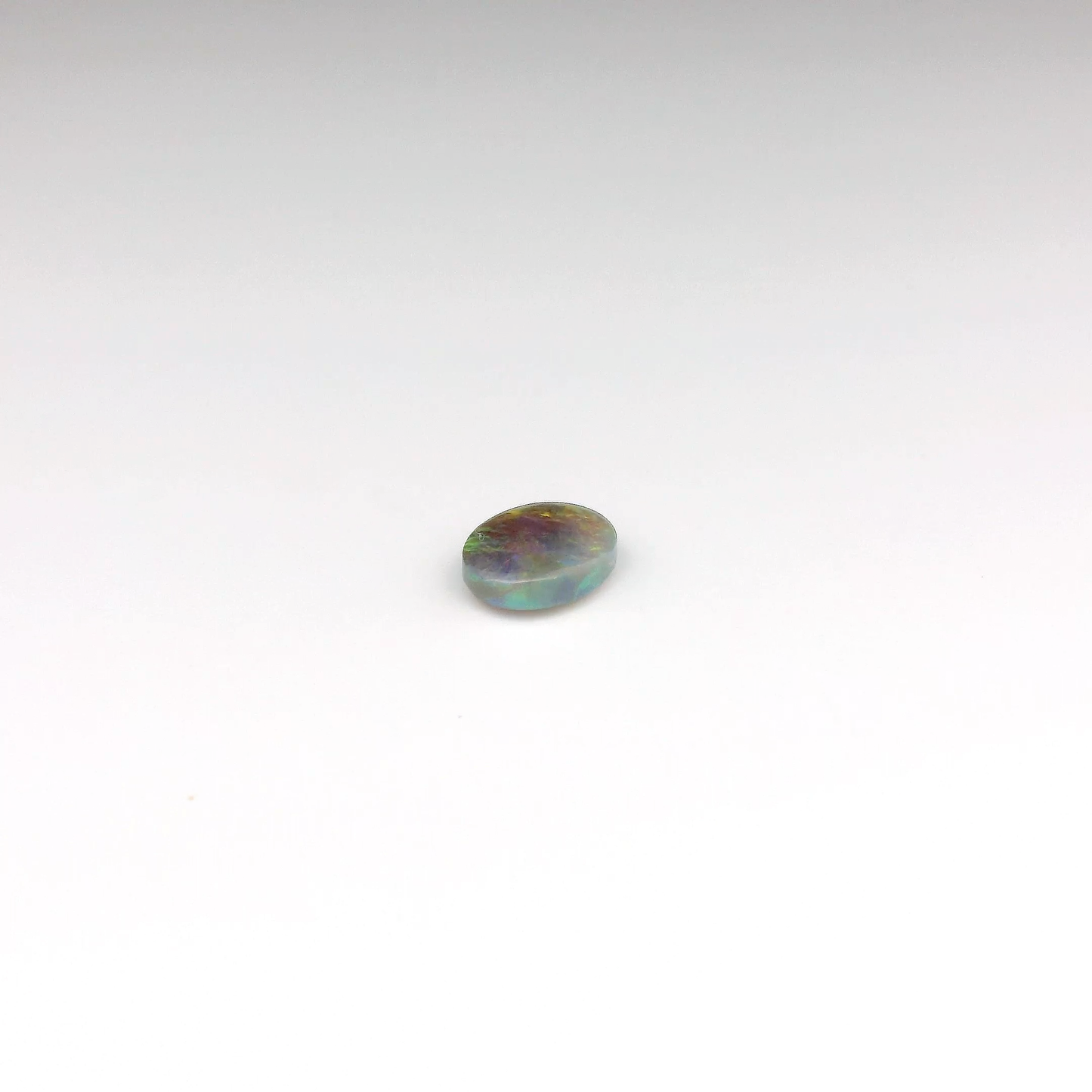 0.7ct Orange, Red Opal Gemstone