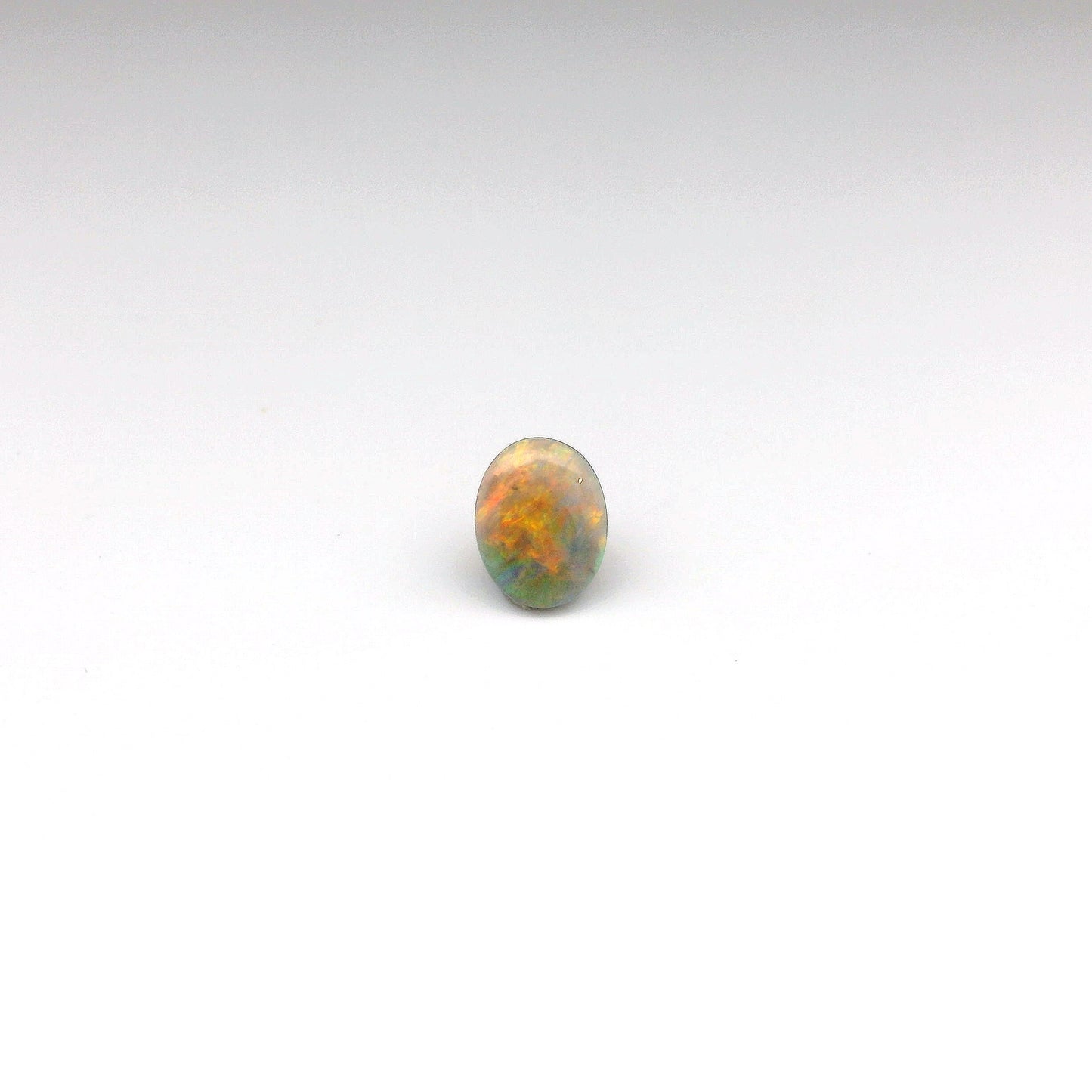 0.7ct Orange, Red Opal Gemstone
