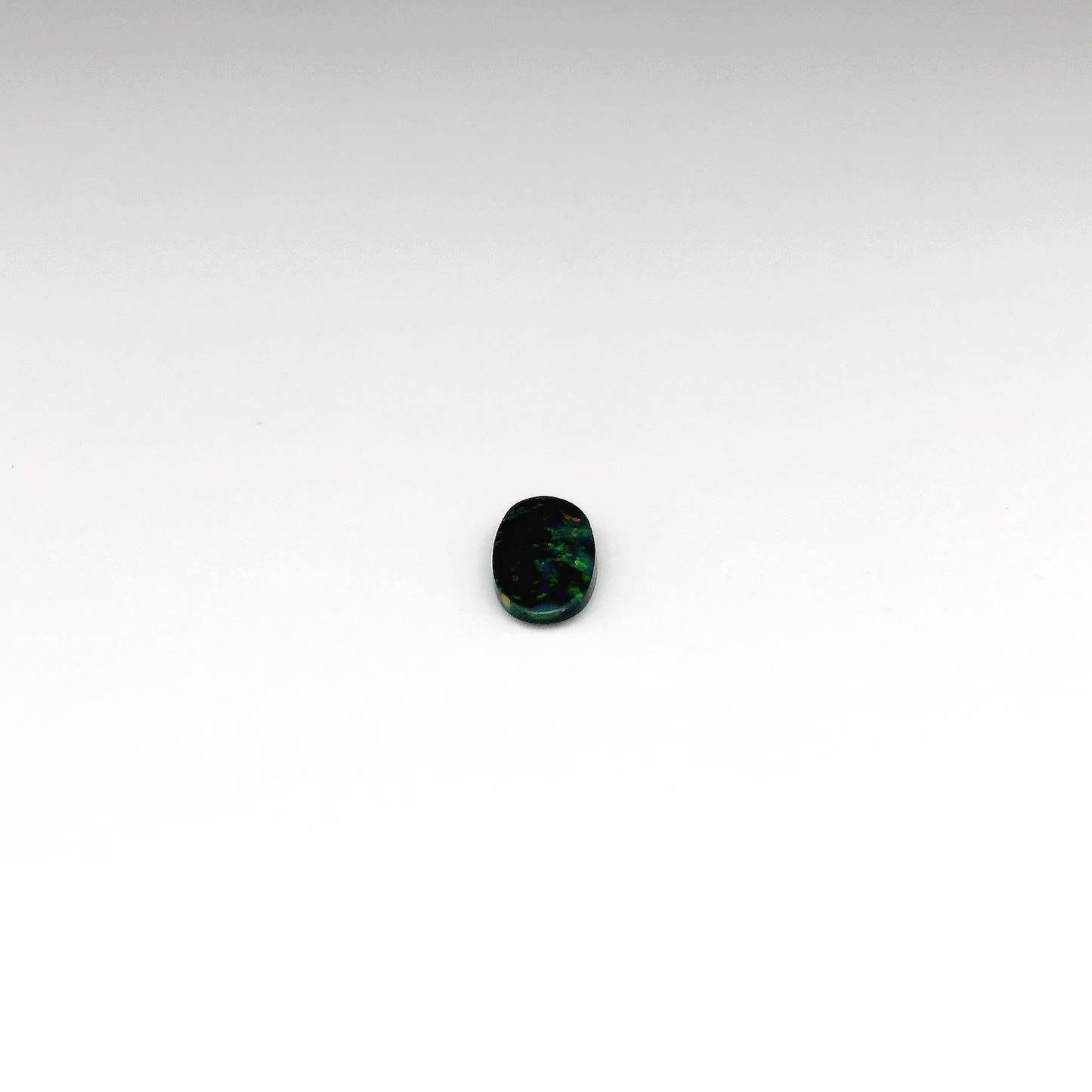 0.41ct Green, Orange Opal Gemstone Display