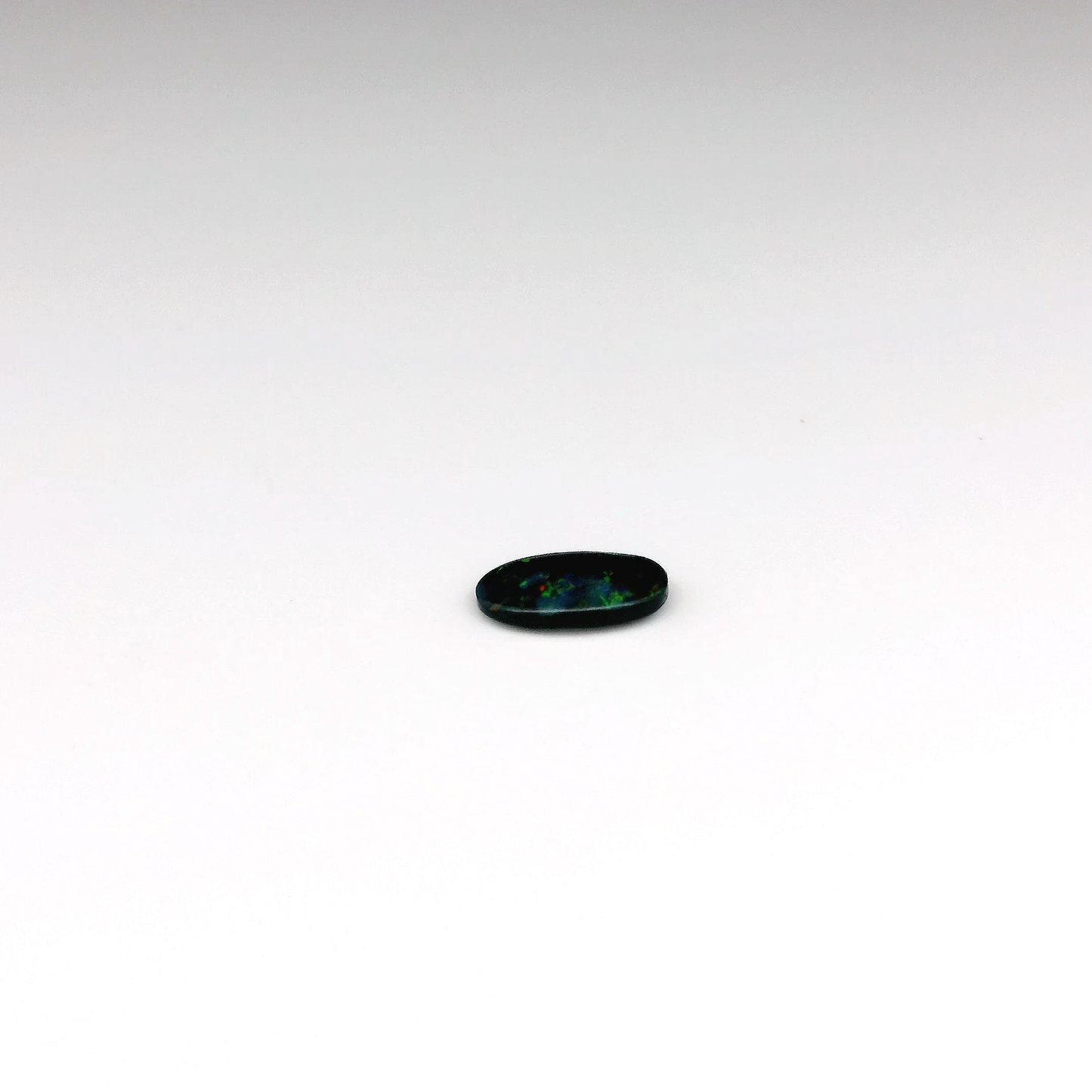 0.41ct Green, Orange Opal Gemstone Display