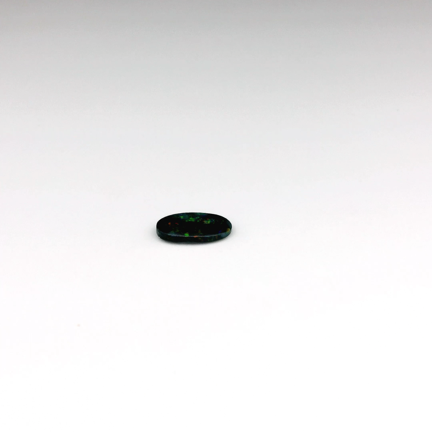 0.41ct Green, Orange Opal Gemstone Display