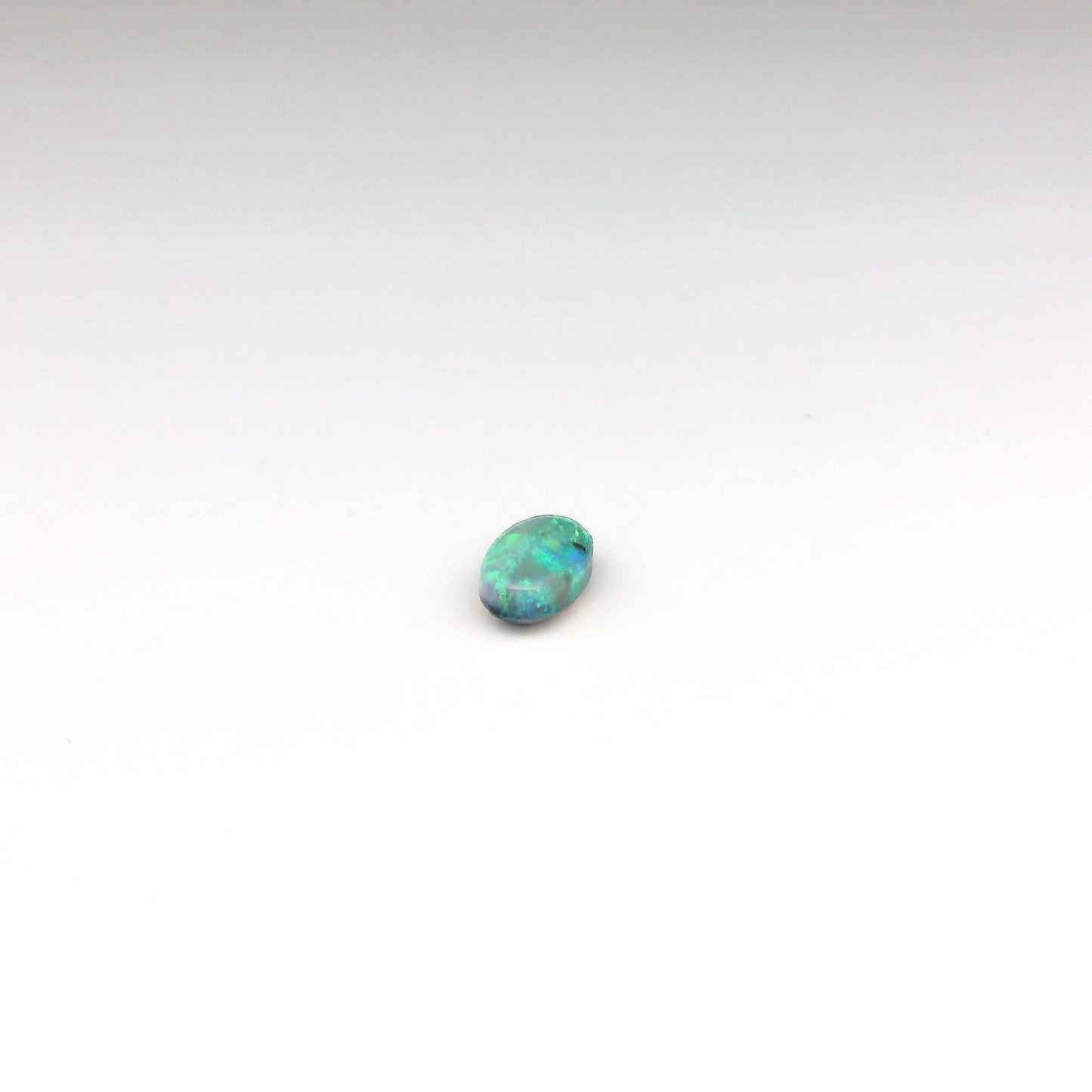 0.53ct Green, Orange Opal Gemstone