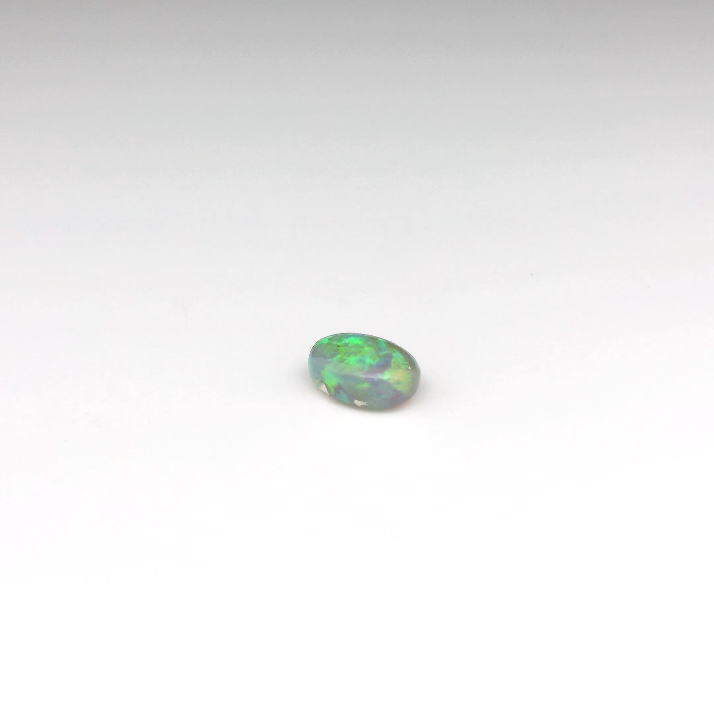 0.9ct Green, Orange Opal Gemstone