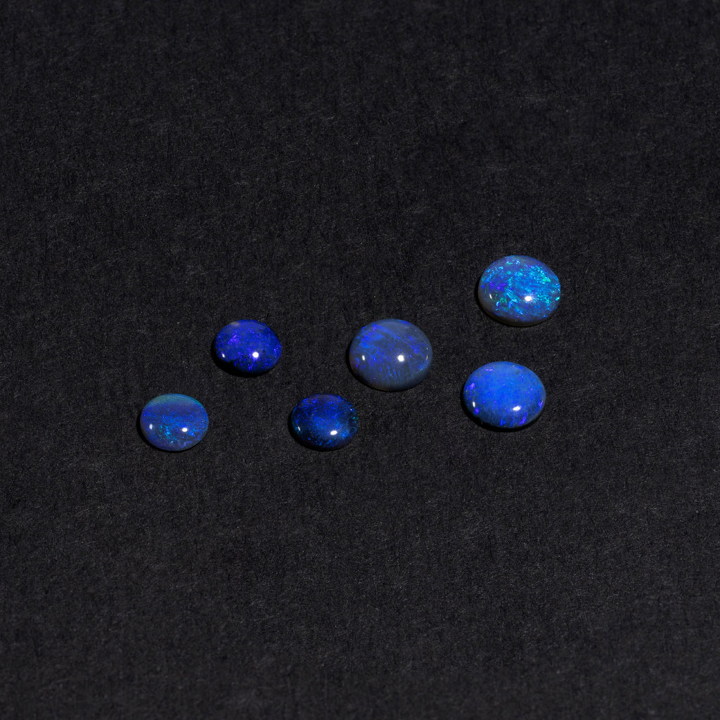 4 to 8mm Lightning Ridge Black Opal Rounds – Blue/Purple