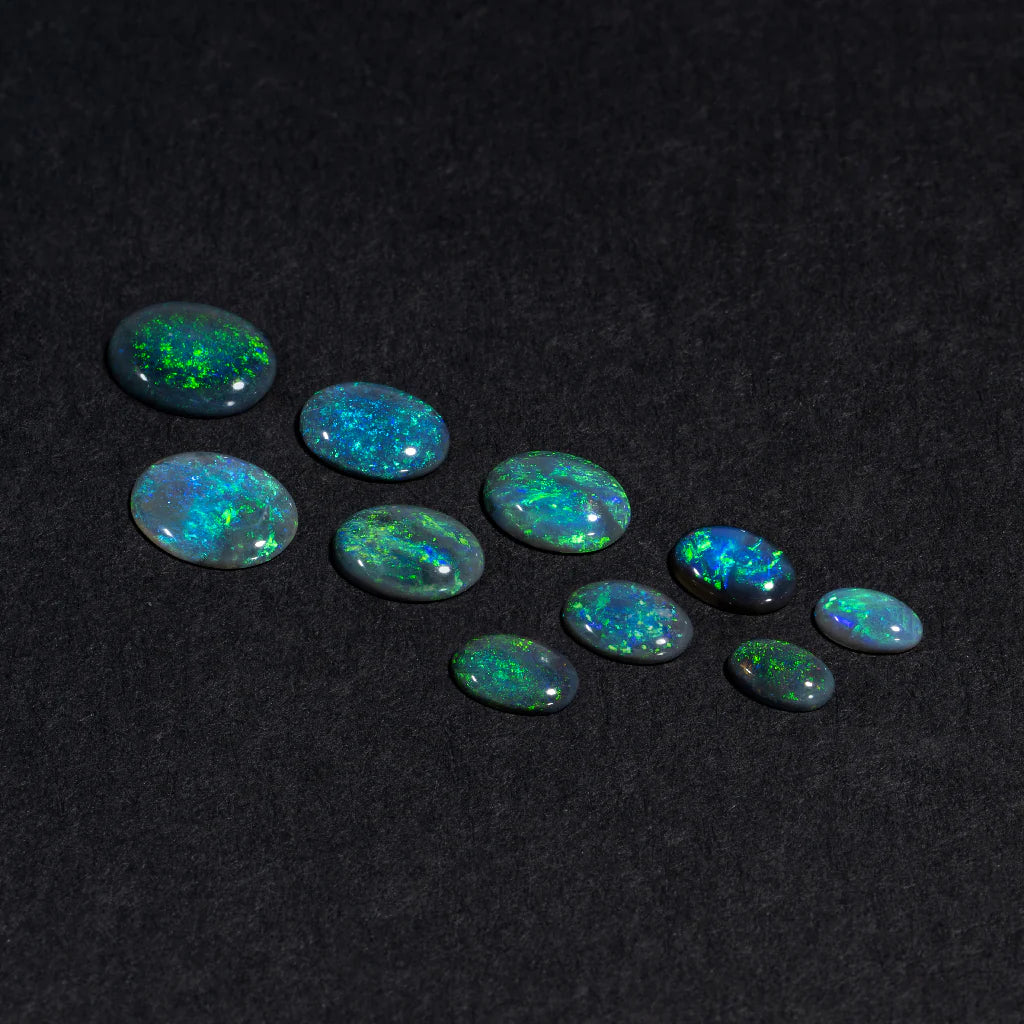 5x3 to 9x7mm Lightning Ridge Black Opal Ovals – Green Play of Colour