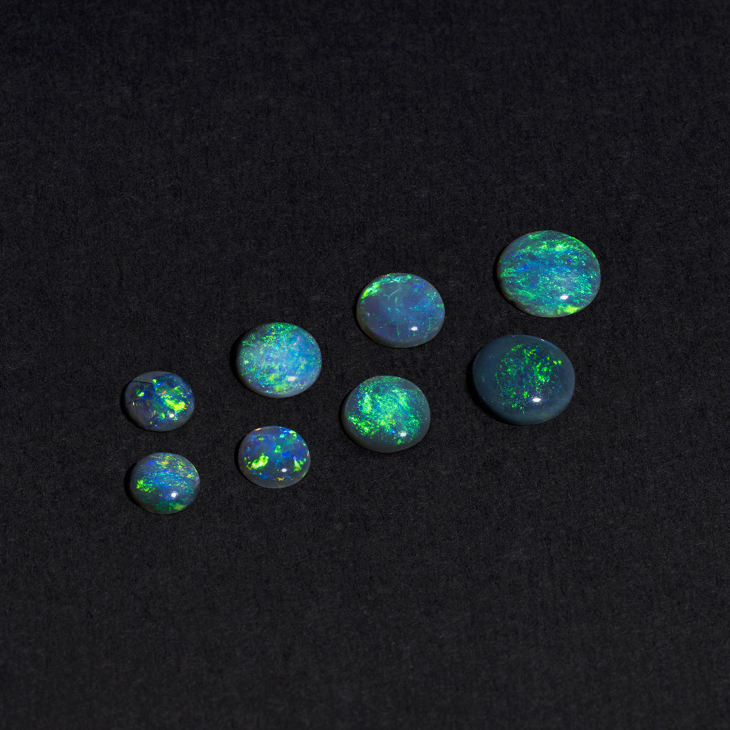 4 to 8mm Lightning Ridge Black Opal Rounds – Green Play of Colour