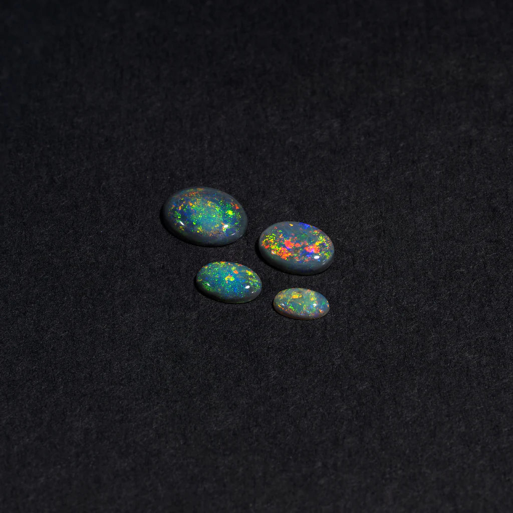 5x3 to 9x7mm Lightning Ridge Black Opal Ovals – Full-Spectrum Play of Colour