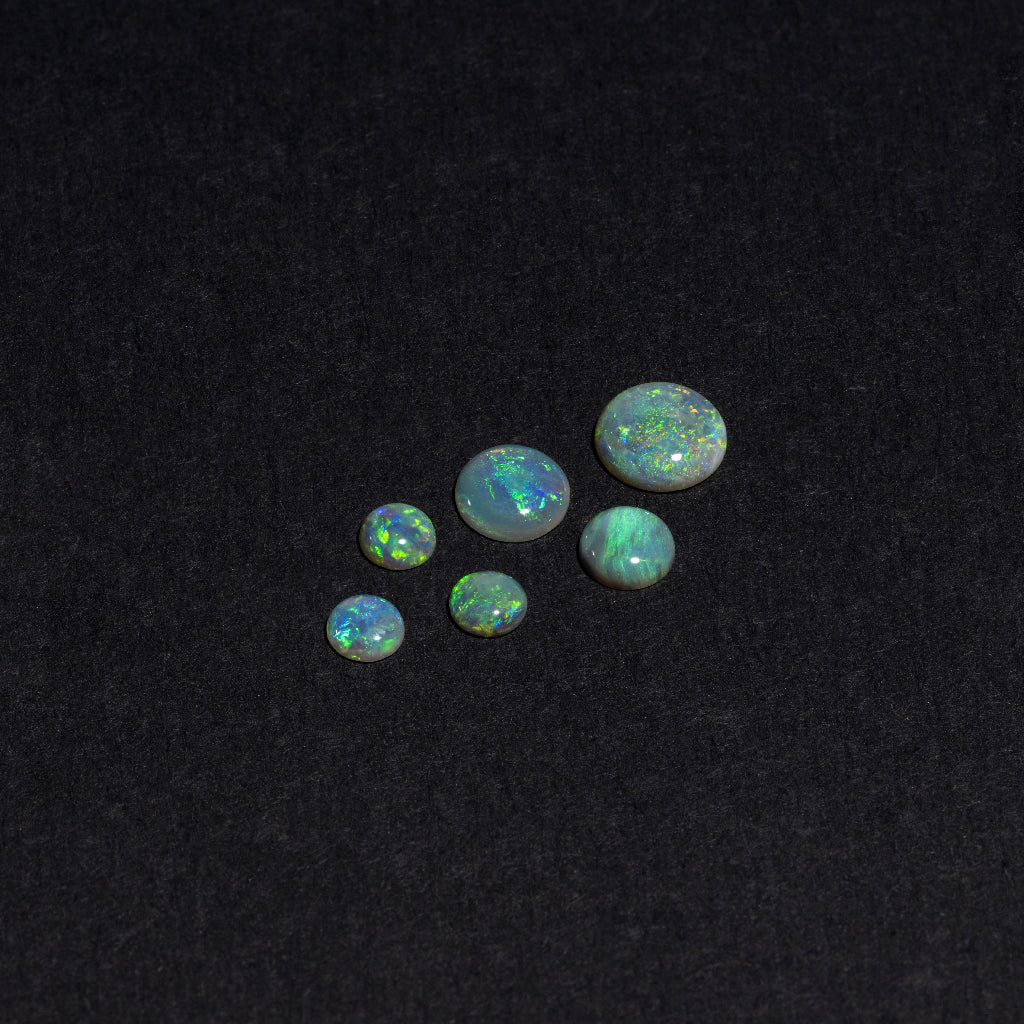 4 to 8mm Lightning Ridge Semi-Black Opal Rounds – Green Play of Color