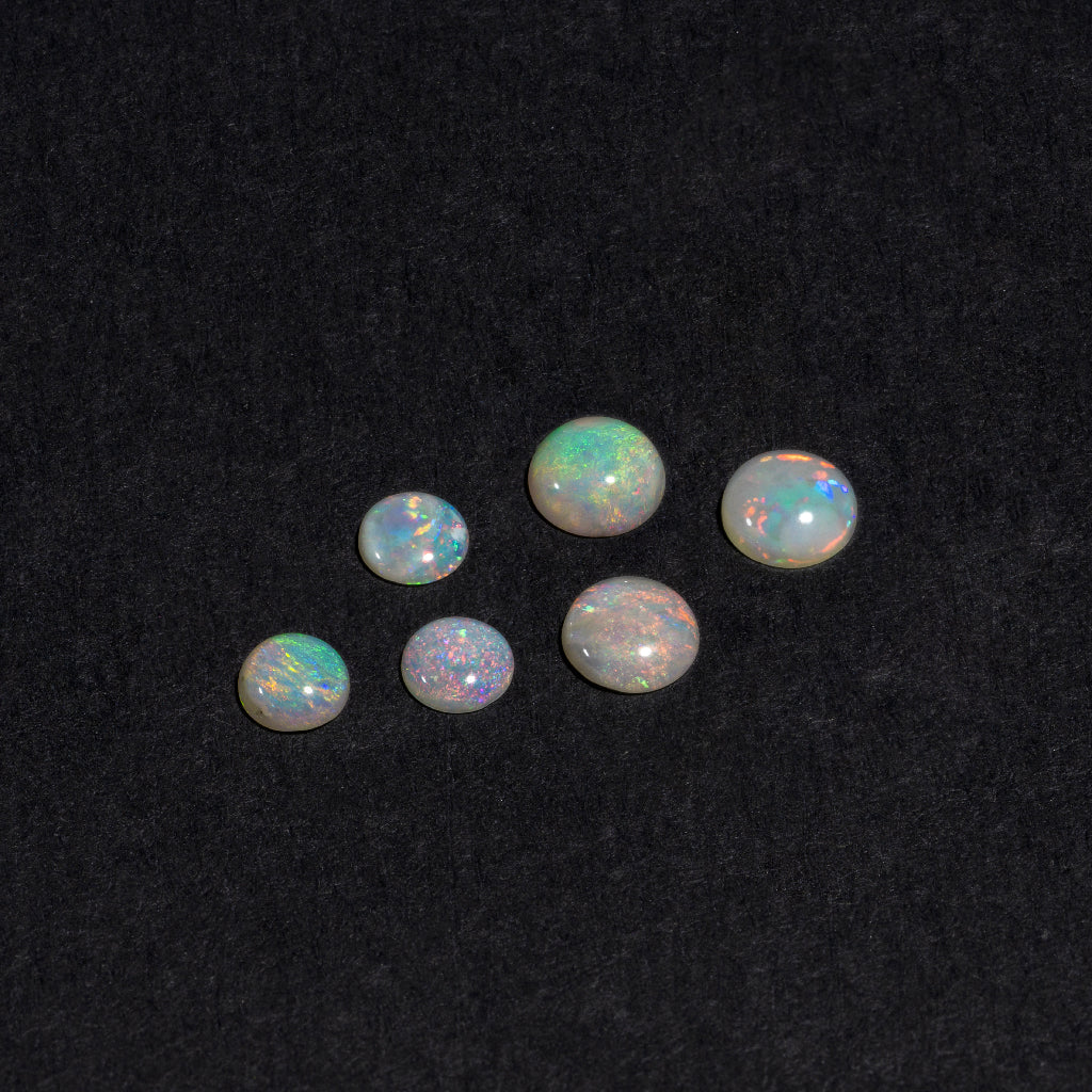 4 to 8mm Lightning Ridge White Opal Rounds – Orange Play of Colour