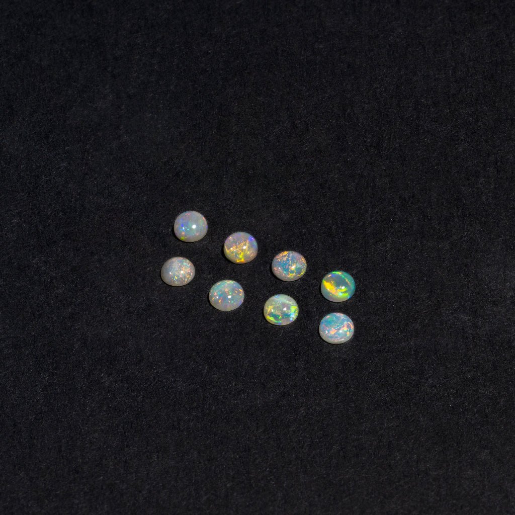 2 to 3.5mm White Opal Rounds – Orange Play of Color