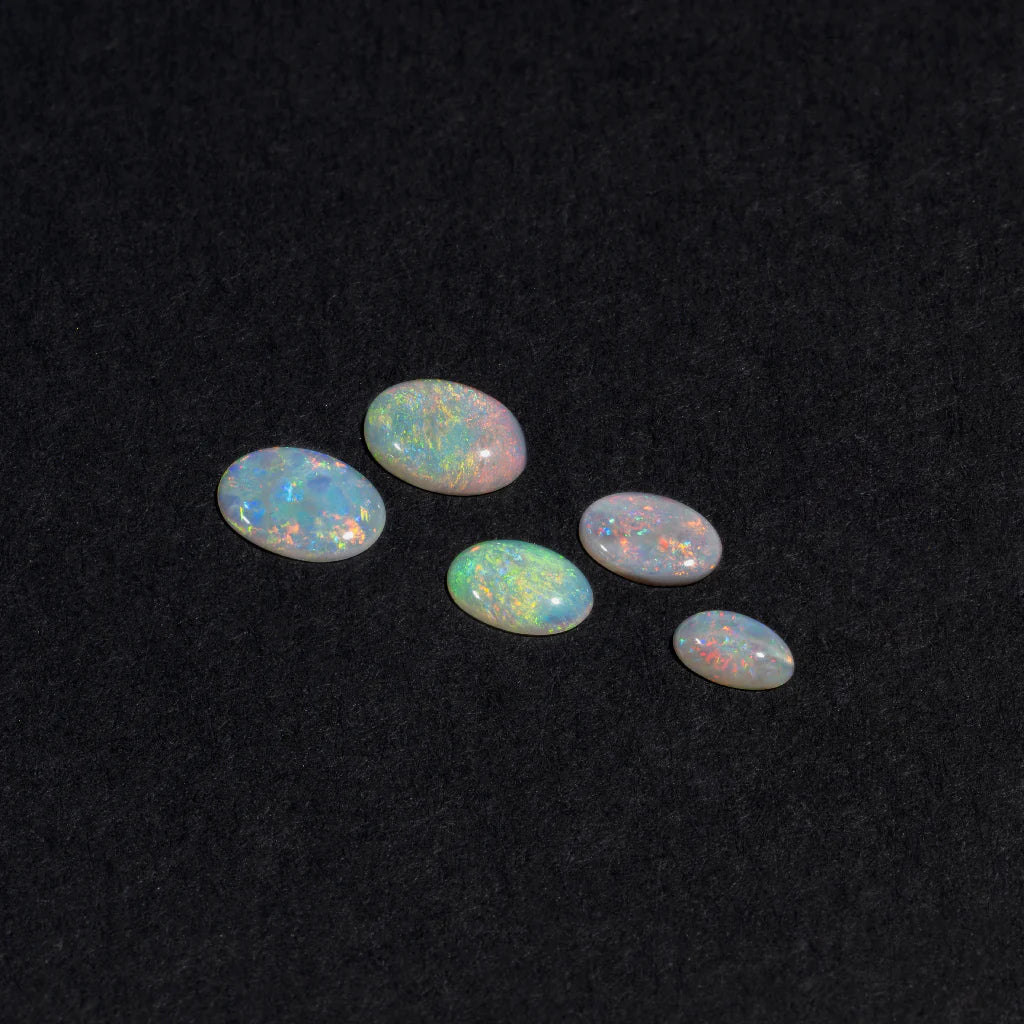 5x3 to 9x7mm Lightning Ridge White Opal Ovals – Orange Play of Colour